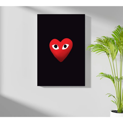 Comme des Garçons heart insigne aluminum print with red heart and white eyes