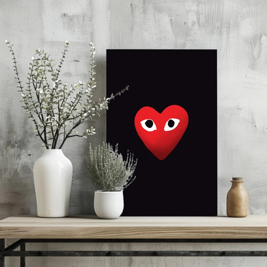 Red Comme des Garçons heart insigne aluminum print with eyes on black