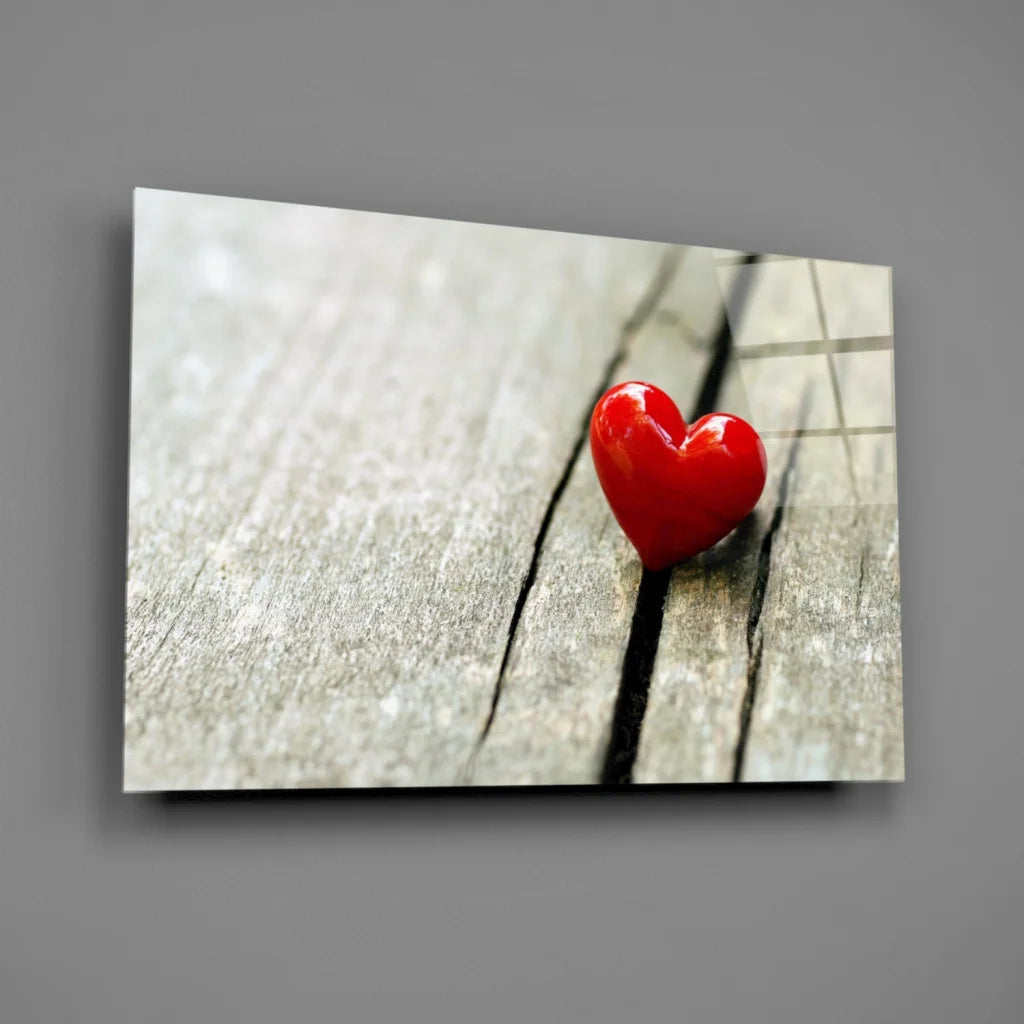Glossy red heart glass wall art on weathered wood planks