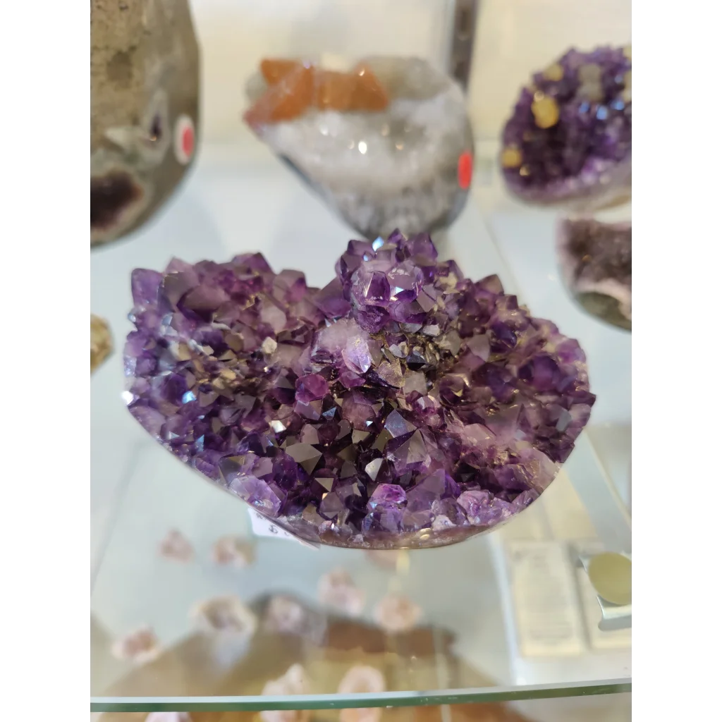 Vibrant purple amethyst heart-shaped flower formation geode sculpture