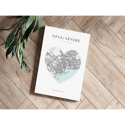 Heart-shaped Singapore map aluminum print in teal and white on wood floor