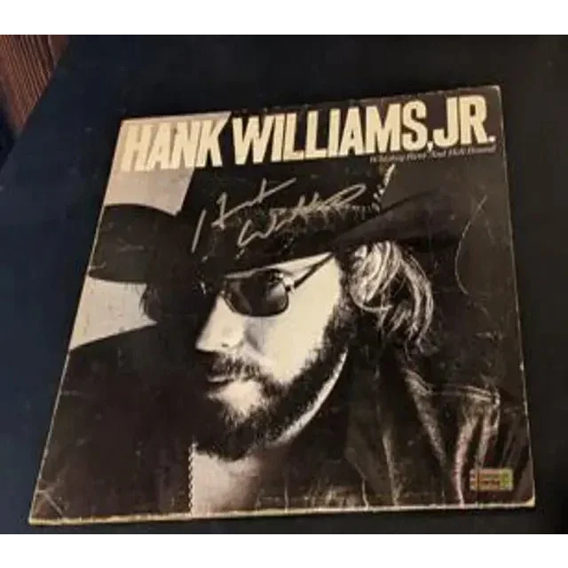 Autographed Hank Williams Jr vinyl album from the Hell Bound collection featuring Williams Jr autographed album