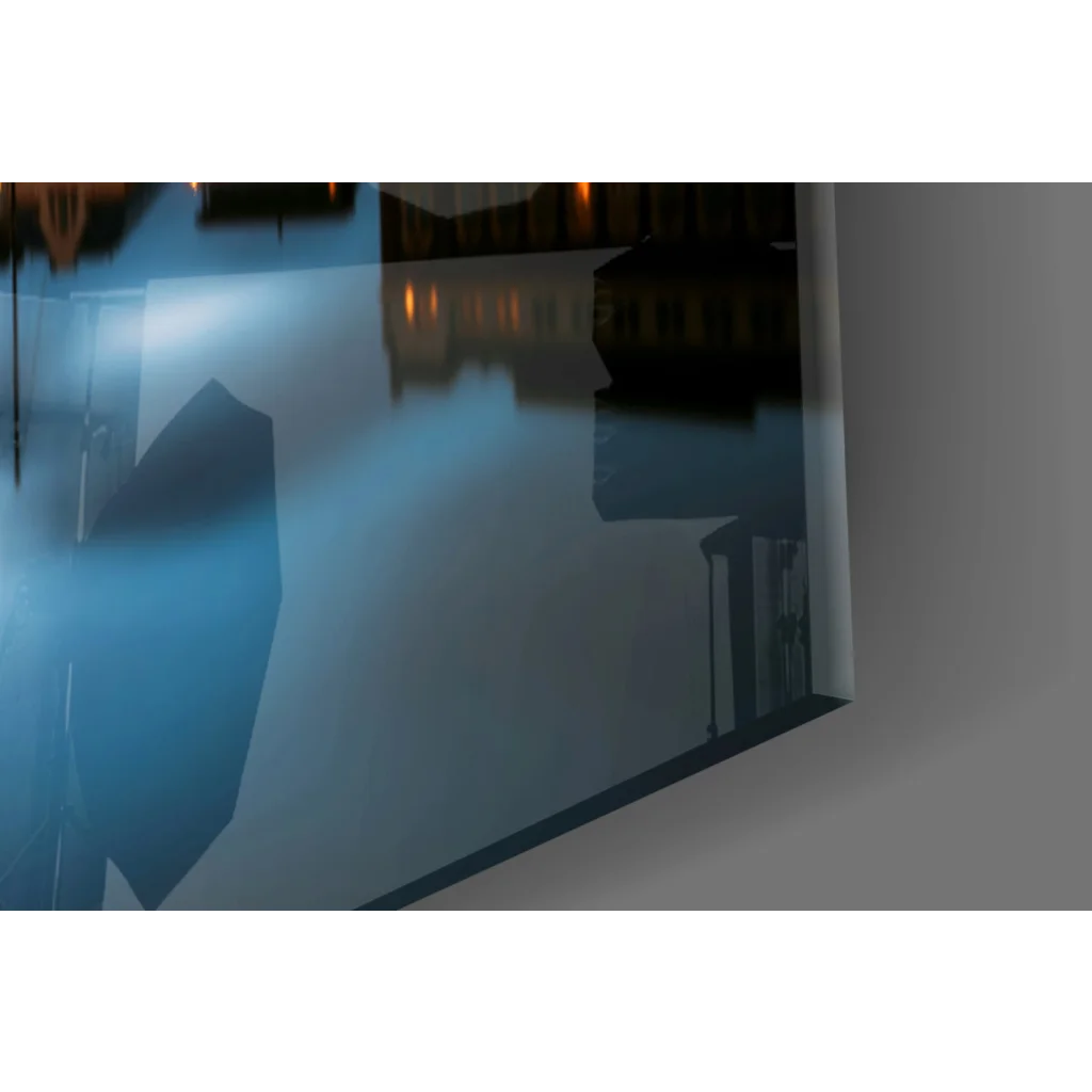Sleek blue-tinted glass wall art with twilight harbor reflections