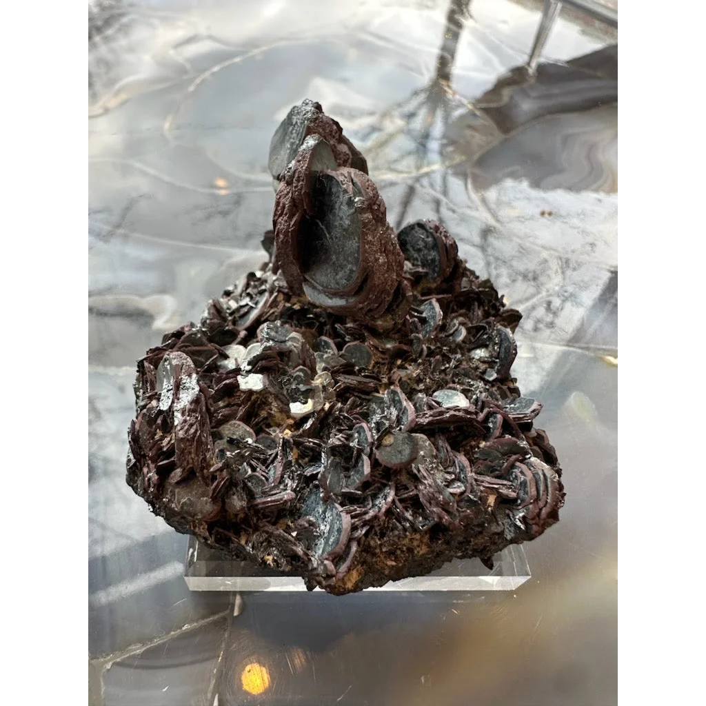 Hematite iron rose mineral specimen with metallic sheen and stand