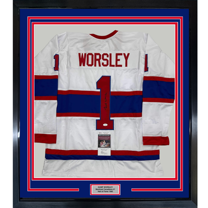 Framed white, red, and blue striped Montreal Canadiens hockey jersey number 1 with "WORSLEY" printed across the chest, mounted behind glass with authentication plaque.