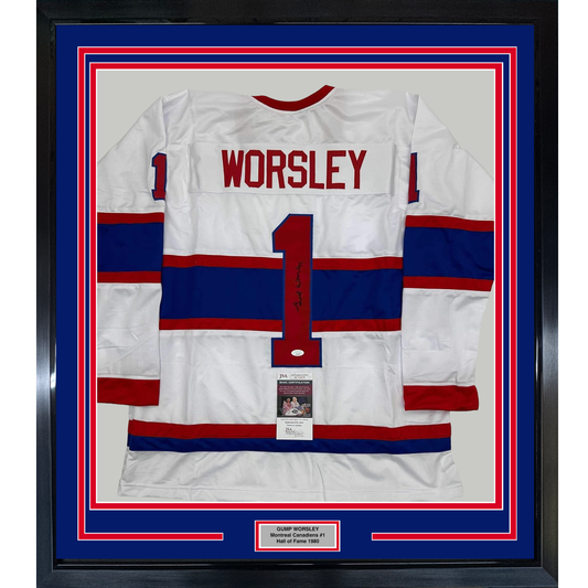 Framed white, red, and blue striped Montreal Canadiens hockey jersey number 1 with "WORSLEY" printed across the chest, mounted behind glass with authentication plaque.