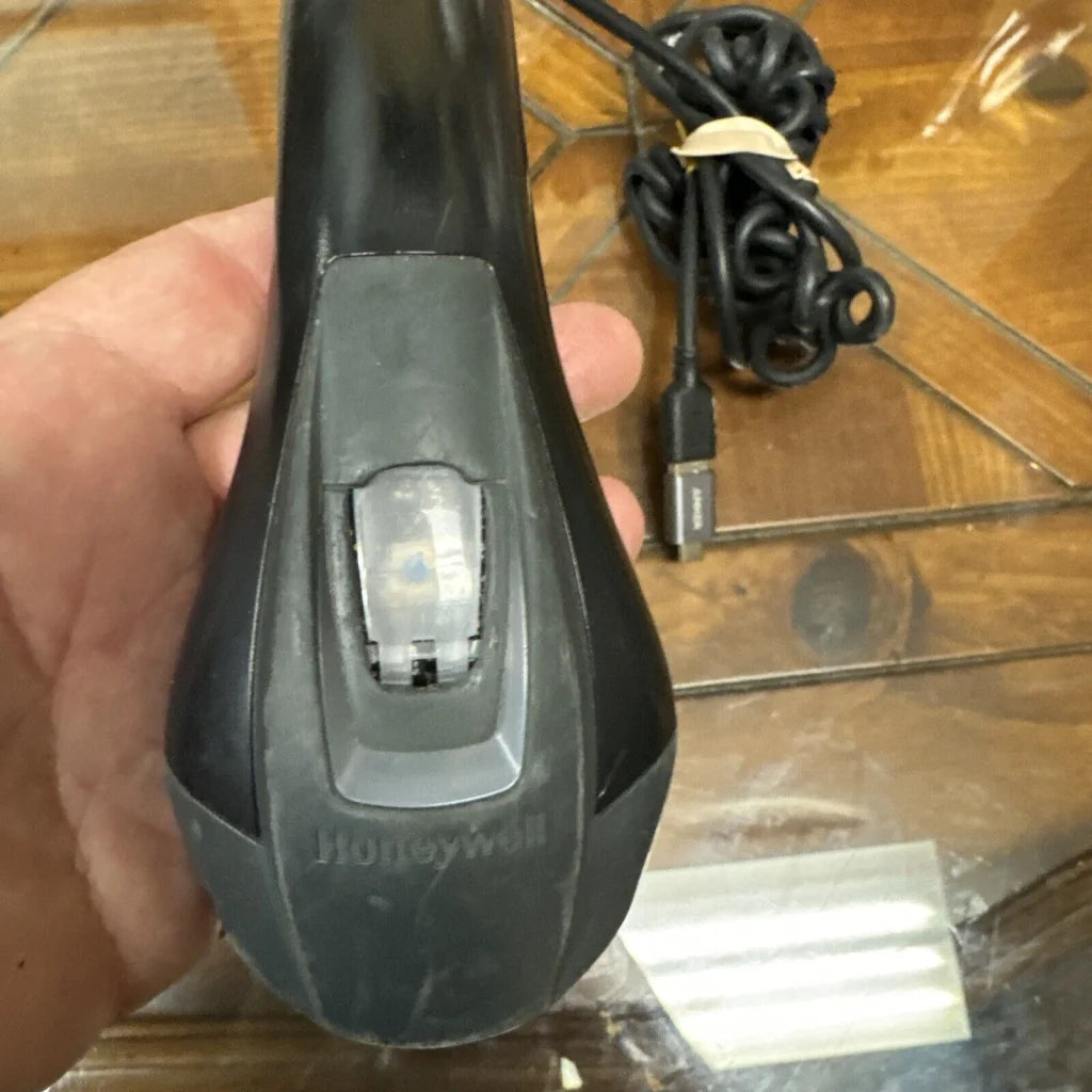 Black Honeywell barcode scanner with gray trigger and transparent window