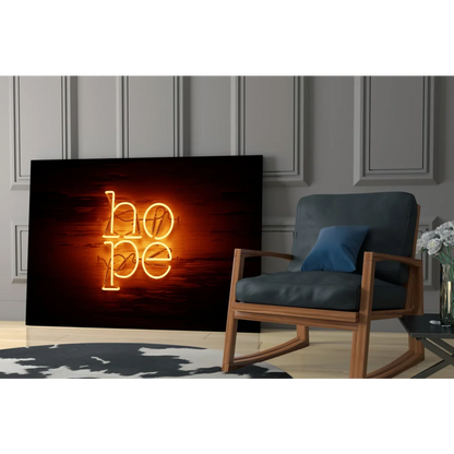 Glowing Hope neon sign wall art in warm orange light on dark textured background