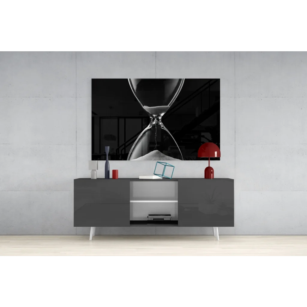 Black-and-white hourglass glass wall art canvas print above gray console