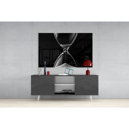 Black-and-white hourglass glass wall art canvas print above gray console