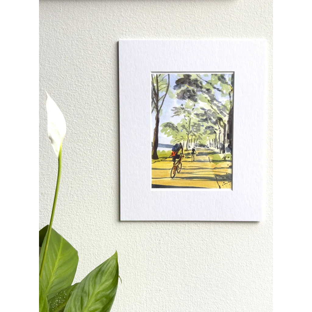 White framed Hudson River original painting of cyclist on tree path