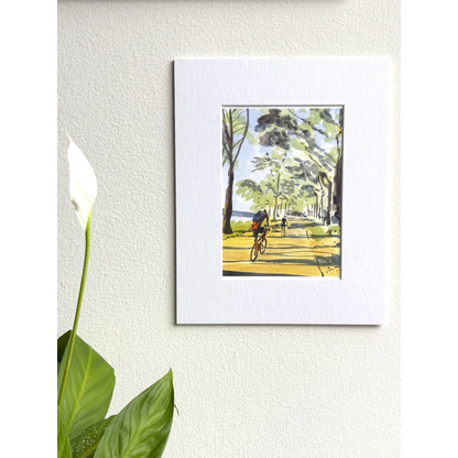 White framed Hudson River original painting of cyclist on tree path