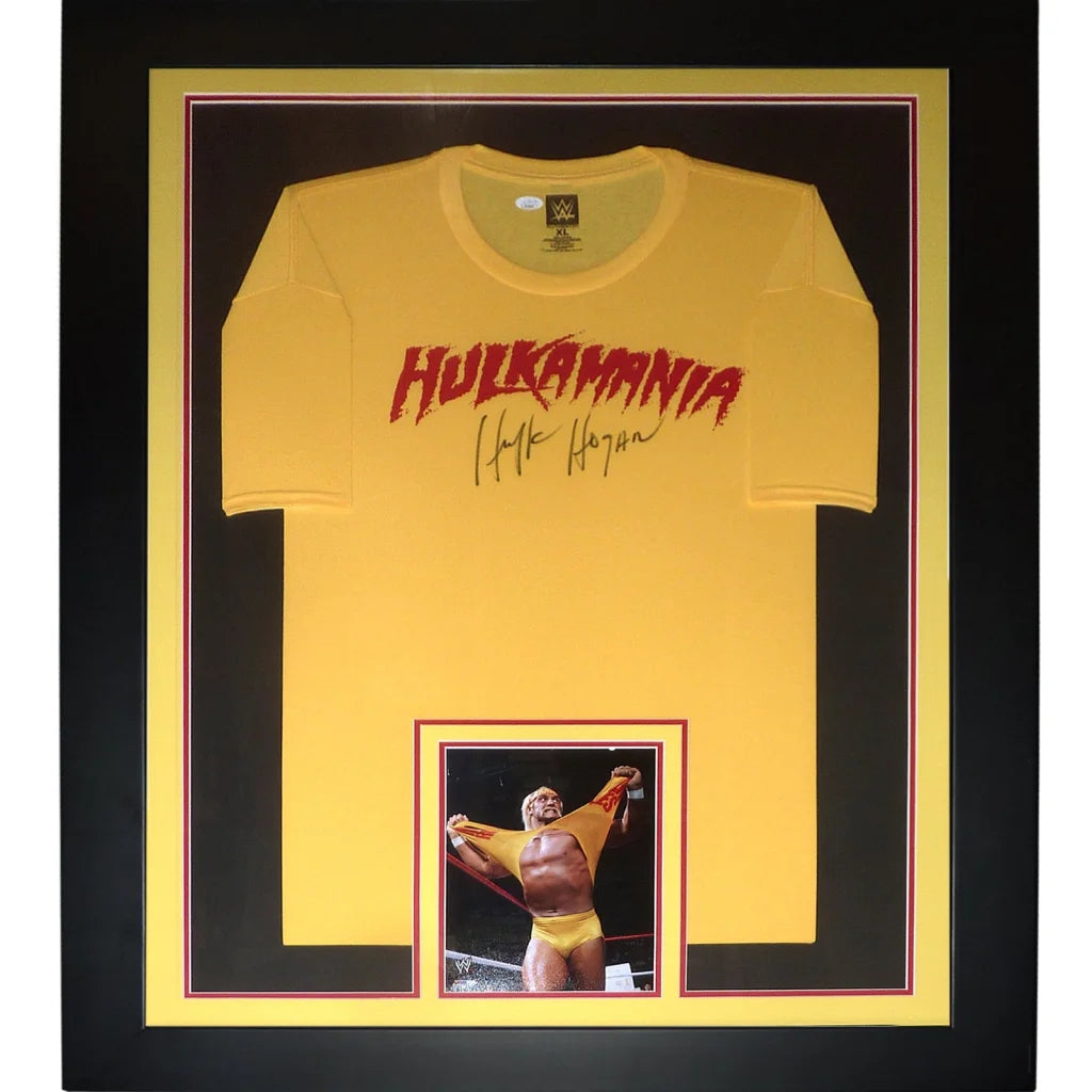 Framed hulkamania yellow t-shirt with red lettering and hulk hogan autographed signature in black frame autographed wrestling deluxe