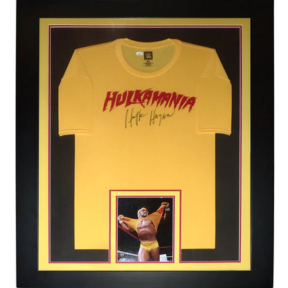 Framed hulkamania yellow t-shirt with red lettering and hulk hogan autographed signature in black frame autographed wrestling deluxe