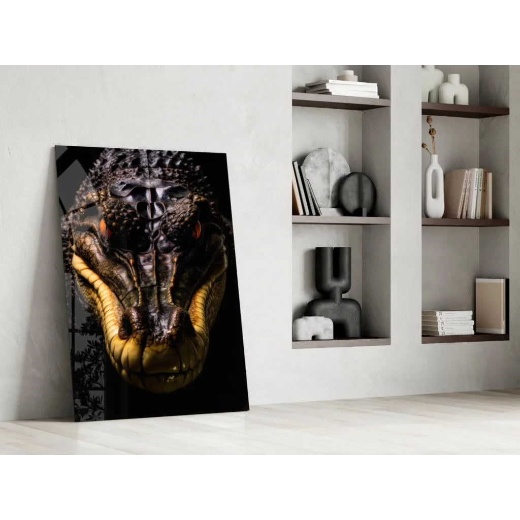 Stunning black-and-gold glass wall art of fierce crocodile head with orange eyes