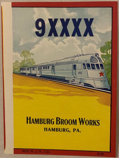 Vintage streamliner train broom label with art deco design, red border, yellow background, blue locomotive illustration, Hamb