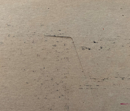 Cream-colored vintage meat packing label with dark printed text and scattered marks on textured paper surface