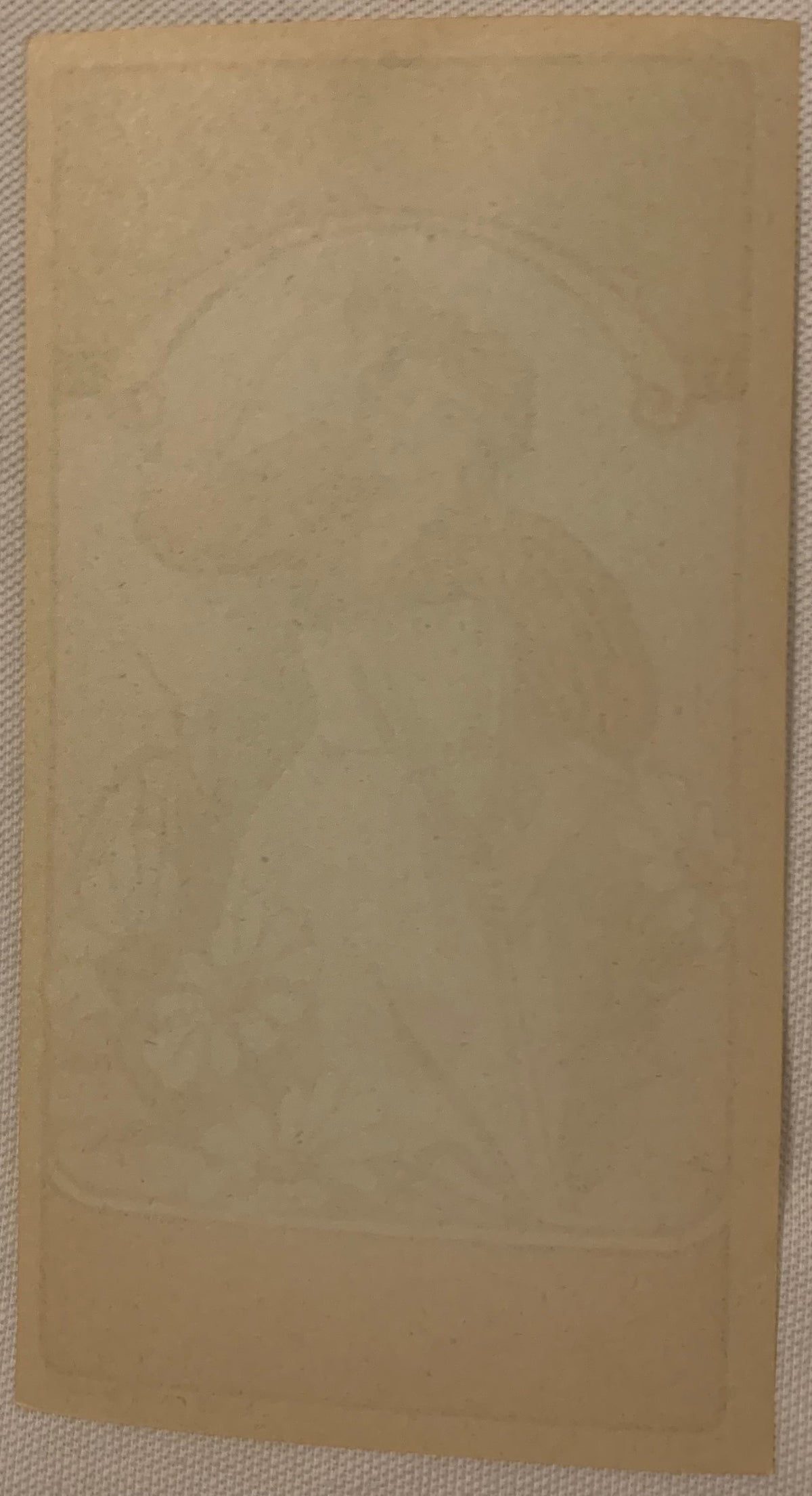 Blank tan lithograph panel with faint decorative border outline, circa 1910s, shown flat on textured fabric background