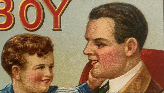 Vintage cigar box label showing an adult man and young boy in profile, with red and gold "BOY" text visible at top, embossed 