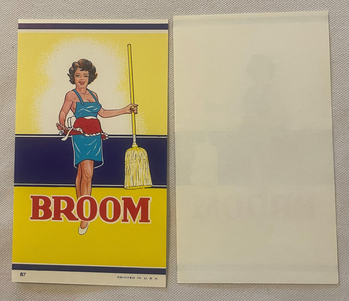 Vintage broom label featuring a smiling woman in blue halter top and red shorts holding a yellow broom, printed in yellow