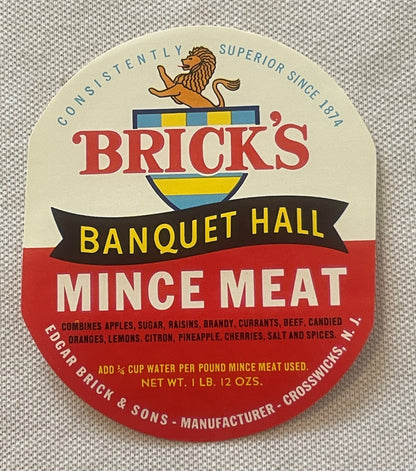 Vintage Brick's Banquet Hall mince meat label with lion logo, red and cream design, printed on fabric background