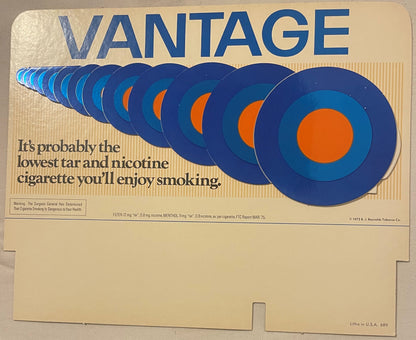 Vintage 1975 Vantage cigarettes store display sign with blue and orange concentric circles and menthol branding on cream back