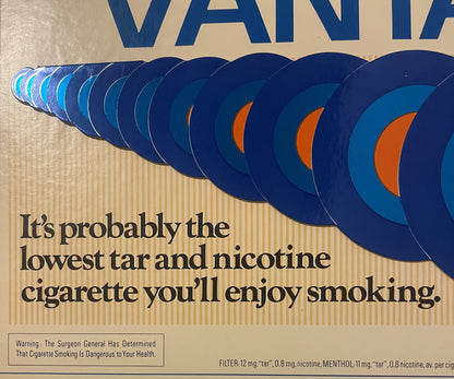 Vintage Vantage cigarette store display sign with blue moon phases and orange crescent, beige background, black