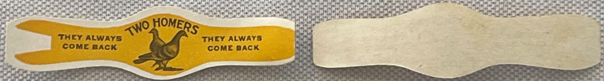 Vintage cigar band with yellow front featuring rooster and "Two Homers" text, plain back shown for comparison against texture