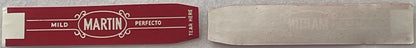 Vintage Martin Mild Perfecto cigar band label in burgundy red with cream decorative oval center, shown flat against light bac