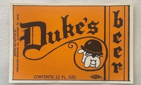 Vintage orange Dukes Beer label featuring a bulldog wearing a bowler hat, 12 fl oz, Horlacher Brewing Company, Allentown Penn