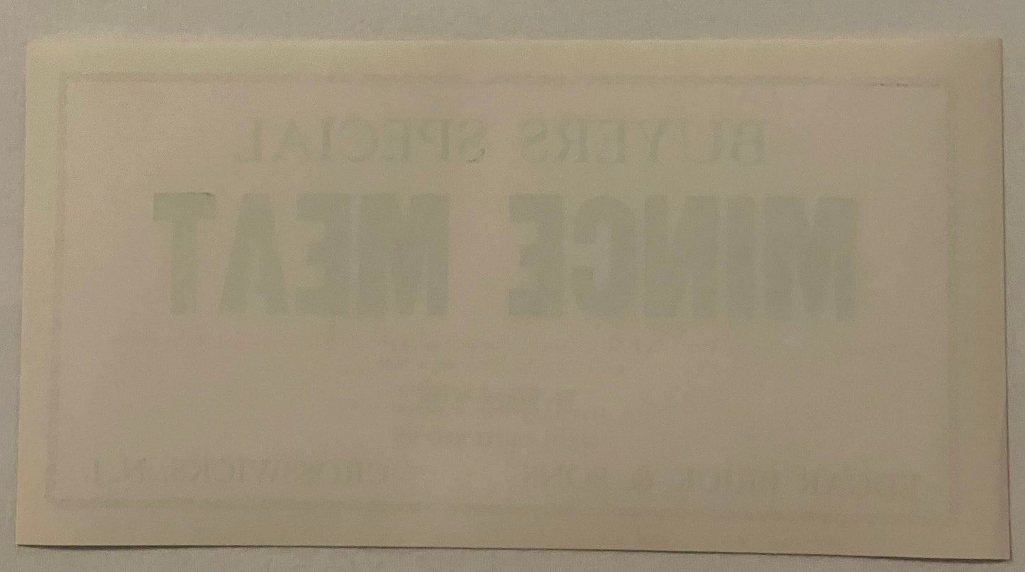 Back of the Buyers Special mince meat label: blank cream paper with no printing at all, showing only the front's BUYERS SPECIAL MINCE MEAT lettering ghosting through the sheet in mirror image