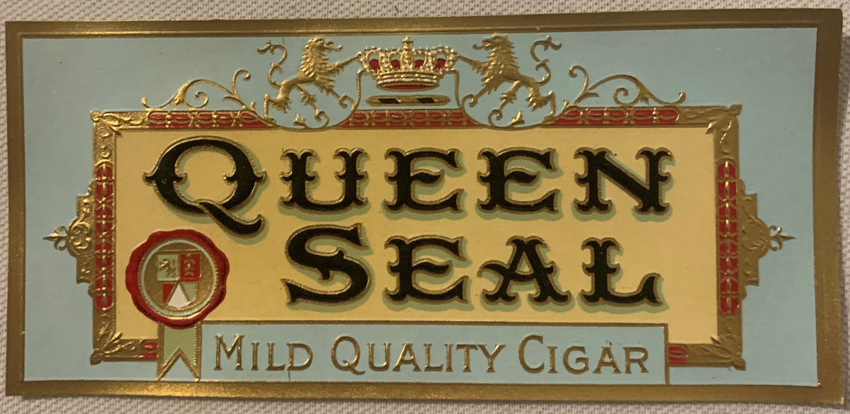 Gold embossed cigar box label reading "Queen Seal" with royal crown, shield, and decorative border on cream background, label