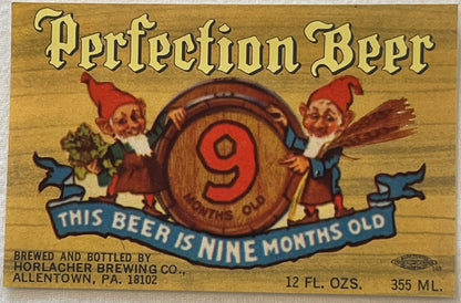 Vintage beer label with gold background, red gnomes holding a barrel marked "9", blue banner