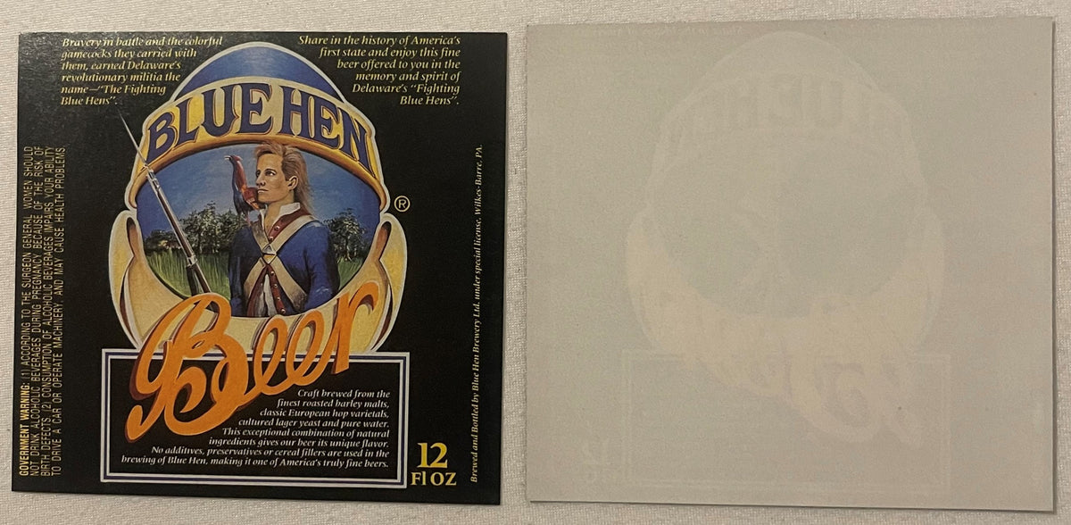 Vintage Blue Hen beer label and blank backing shown flat, featuring colonial soldier in blue uniform with rifle and gold text