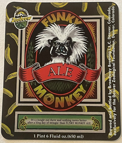 The whole Funky Monkey Ale bottle label - tamarin oval on dark olive strewn with yellow bananas, FUNKY above, MONKEY below, red ALE banner across. Green panel: It's a jungle out there... Foot: 1 Pint 6 Fluid oz.(650 ml), Broadway Brewing L.L.C.