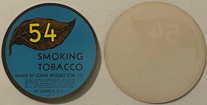 Round tobacco label with blue background, brown leaf illustration, yellow "54" text, and "SMOKING TOBACCO MADE BY JOHN WEISER