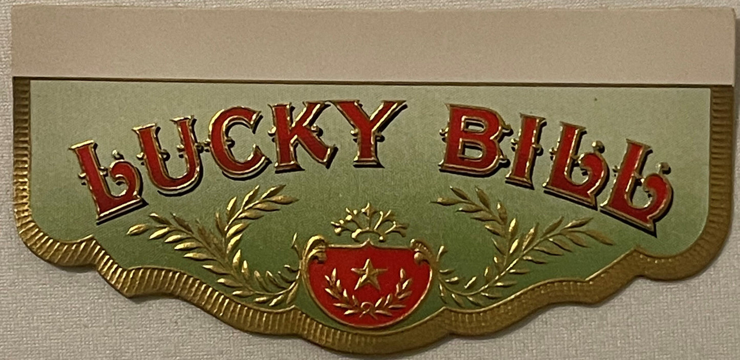 Gold-embossed cigar box label with red "LUCKY BID" text, green background, laurel wreaths, red shield with star, scalloped ed
