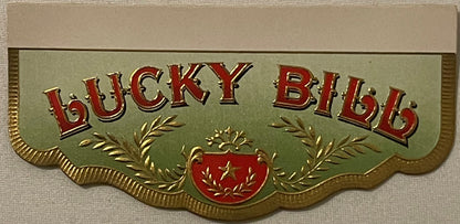 Gold-embossed cigar box label with red "LUCKY BID" text, green background, laurel wreaths, red shield with star, scalloped ed
