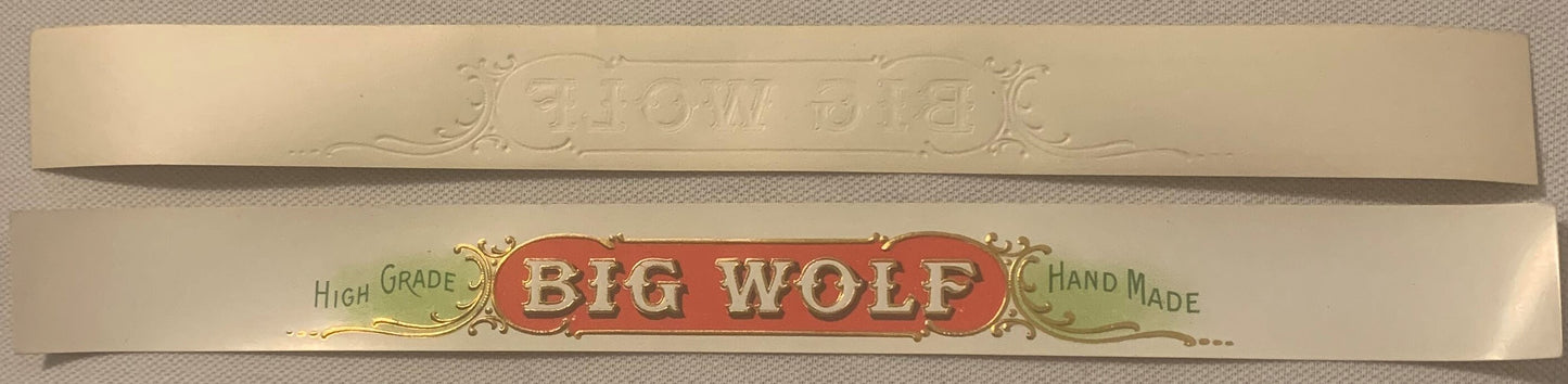 Two antique cigar label strips with embossed gold foil lettering reading "Big Wolf," marked "High Grade" and "Hand Made" on c