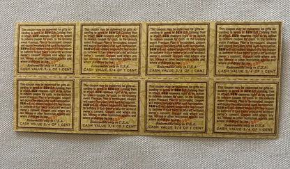 Uncut sheet of eight tan and brown vintage B&W tobacco coupons with printed text, each valued at 3/4 of one cent, arranged in