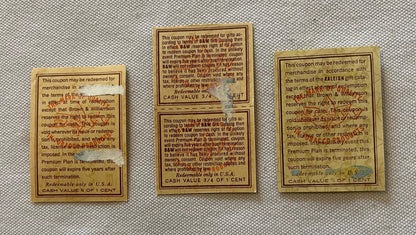 Three vintage tobacco coupons from Brown & Williamson on tan paper with printed text and cash value denominations displayed o