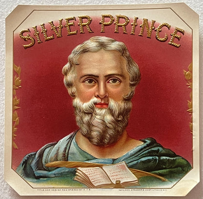 Vintage cigar box label featuring bearded man in classical robes with open book, "Silver Prince" text in gold lettering on re