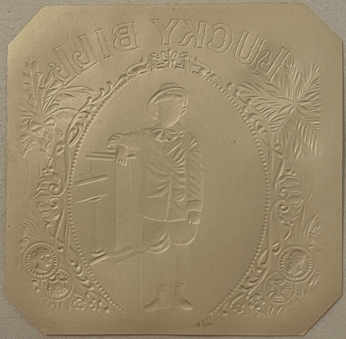 Cream-colored embossed cigar label with ornate border, profile portrait of man in center, text reading "Lucky Bill" at top, c