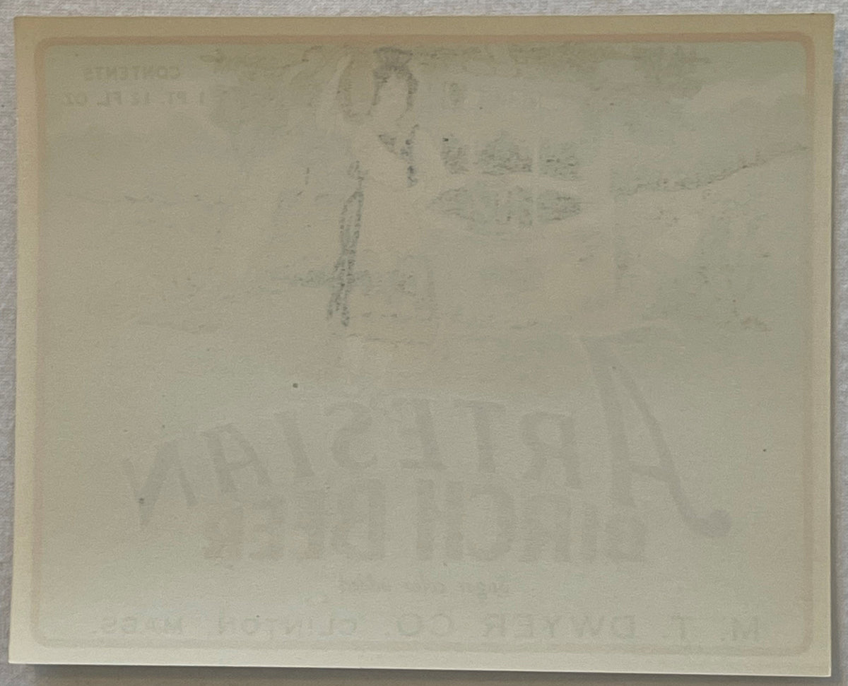 Reverse of the Artesian Birch Beer label, close up: plain paper with the front artwork and lettering showing faintly through from the other side.