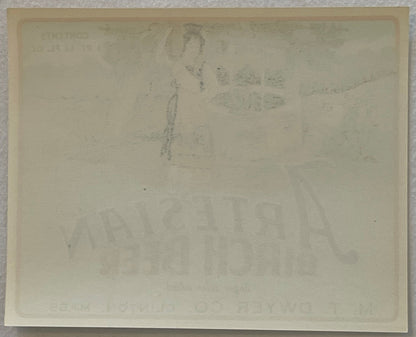 Reverse of the Artesian Birch Beer label, close up: plain paper with the front artwork and lettering showing faintly through from the other side.