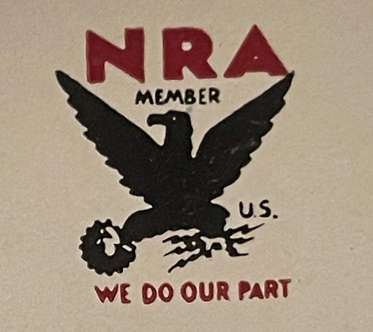 Antique cigar box label featuring red "NRA" letters above a black eagle with outstretched wings holding a gear and lightning bolt, with "MEMBER U.S." and "WE DO OUR PART" text on cream background.