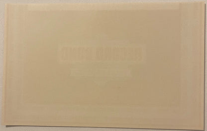 Reverse of the Record Bond label: blank cream paper with only a faint show-through ghost of the printing on the front - no printing of any kind on the back