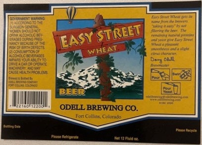 Vintage Easy Street Wheat beer label from Odell Brewing Co in Fort Collins, Colorado, featuring mountain imagery and yellow a