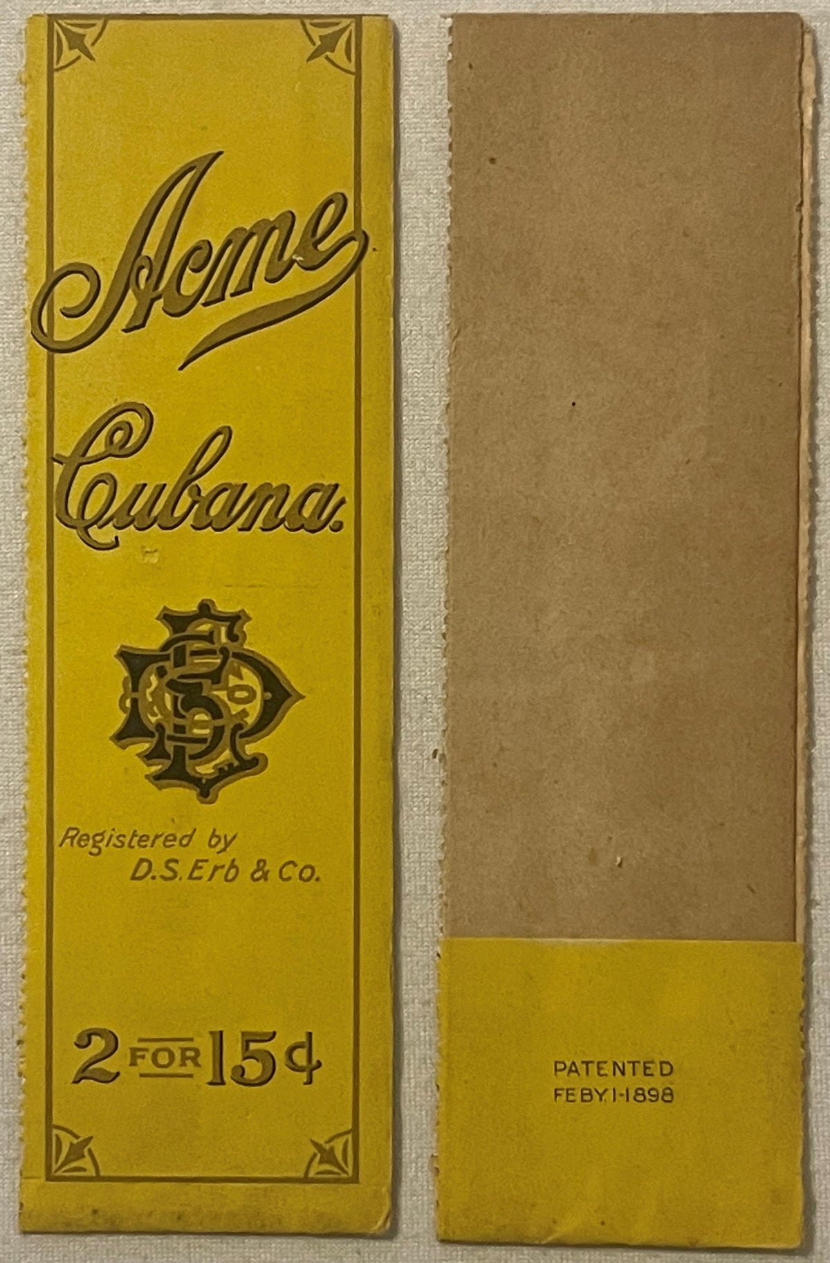 Front and back of yellow cigar bag label with ornate borders, "Acme Cubana" text, D.S. Erb & Co registration mark, "2 FOR 15¢