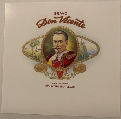 Vintage cigar box label featuring a bearded man in red royal attire within ornate gold frame, with "BRAVO Don Vicente" text a